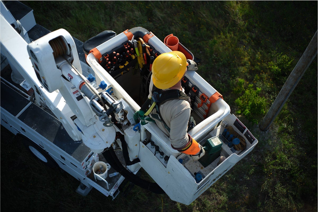 lineman in bucket with the bucket work center