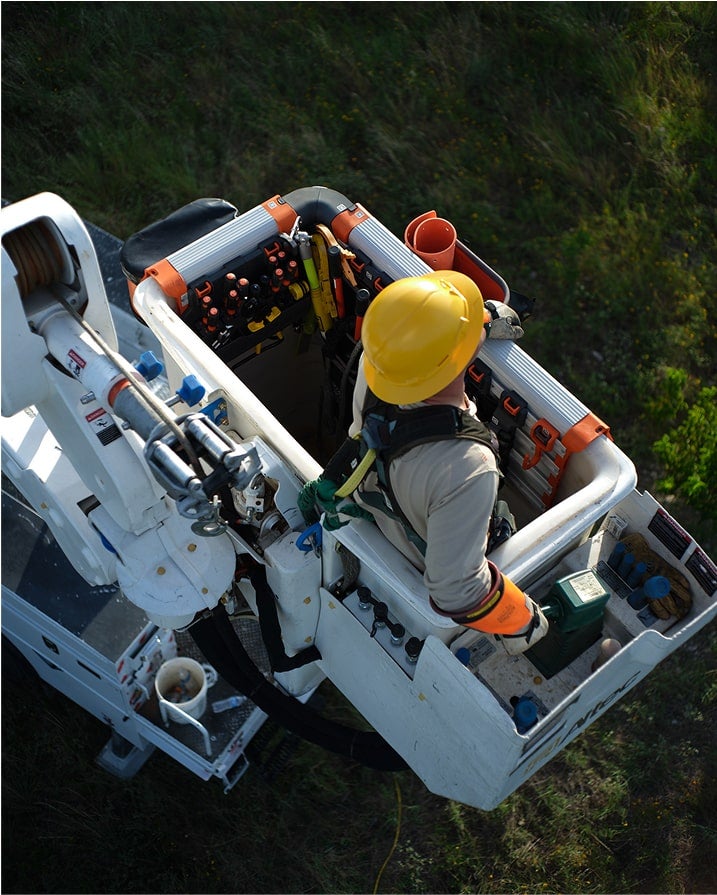 lineman in bucket with the bucket work center