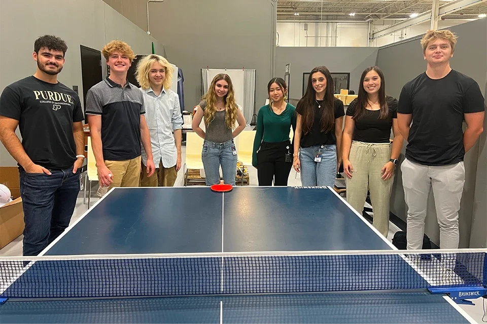 Klein Tools interns standing in front of ping pong table