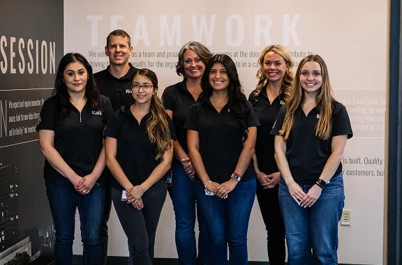 Klein Tools human resources team lined up in corporate office