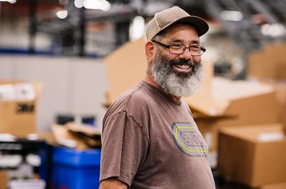 Klein Tools plant worker smiling and happy at work