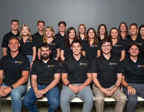 large group of Klein Tools interns lined up for team photo