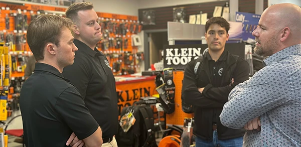 KLP participants talking to a Klein leadership executive in a store