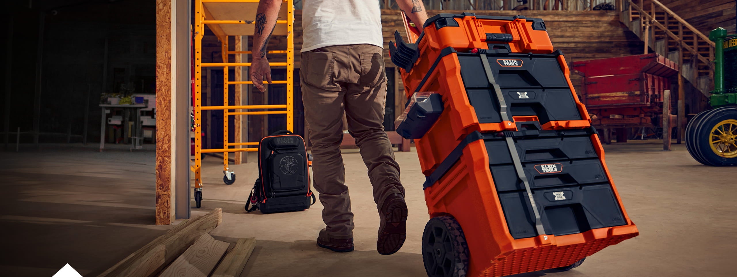 man pulling a MODbox stack through a jobsite
