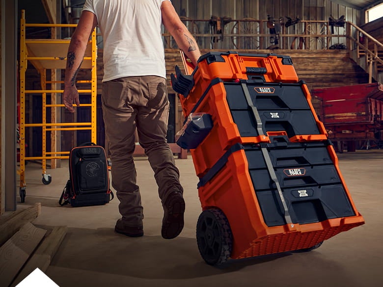 man pulling a MODbox stack through a jobsite