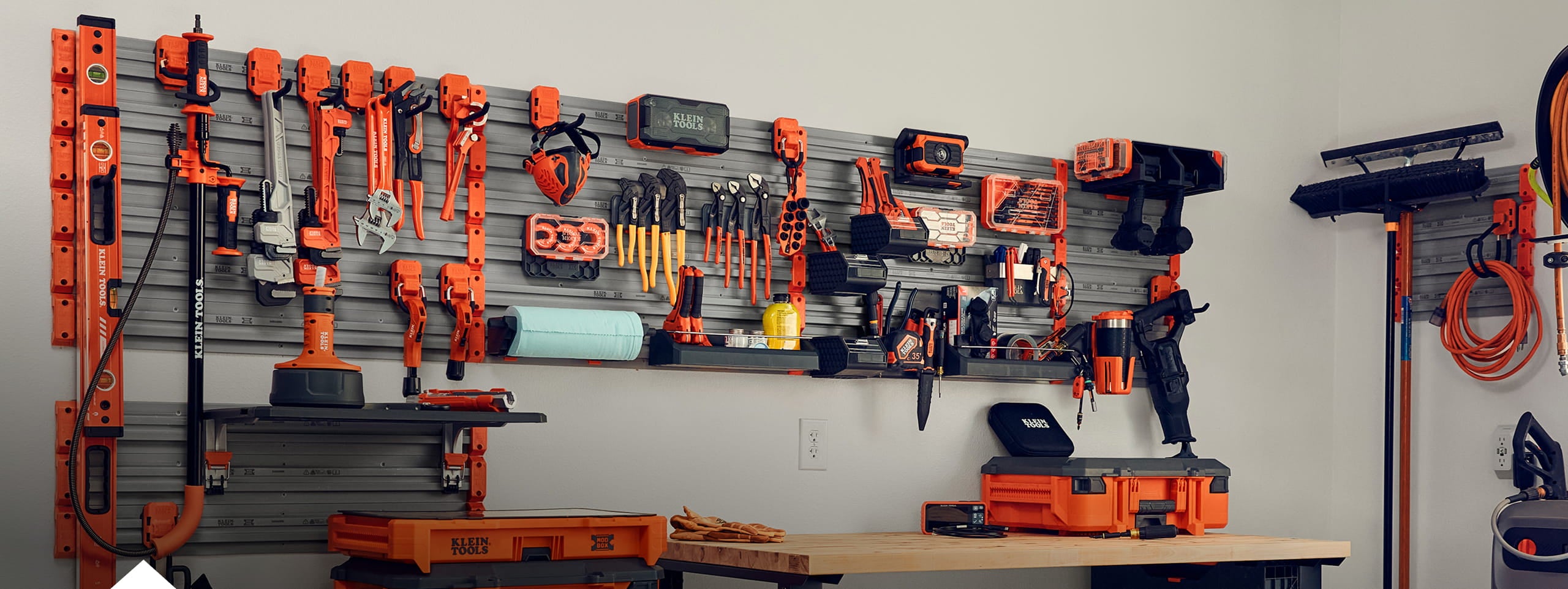 a MODwall system setup in a finished garage with accessories and filled with Klein Tools products