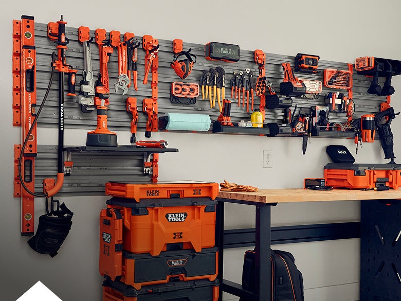 a MODwall system setup in a finished garage with accessories and filled with Klein Tools products