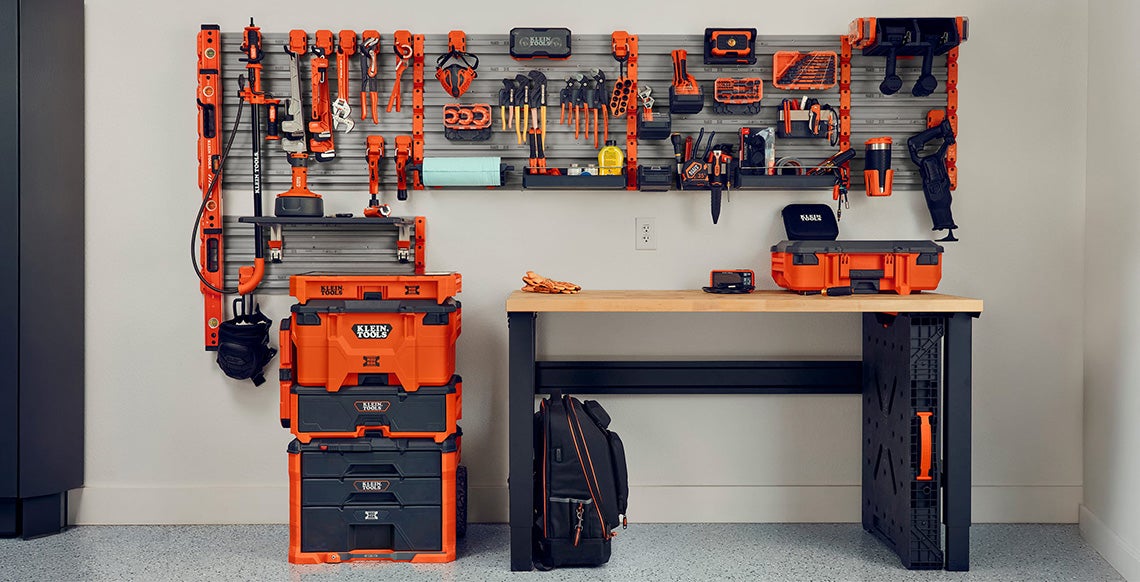 photo of modwall system setup in finished garage with drywall background and epoxy floor and modbox accessories attached and Klein Tools products placed in accessories