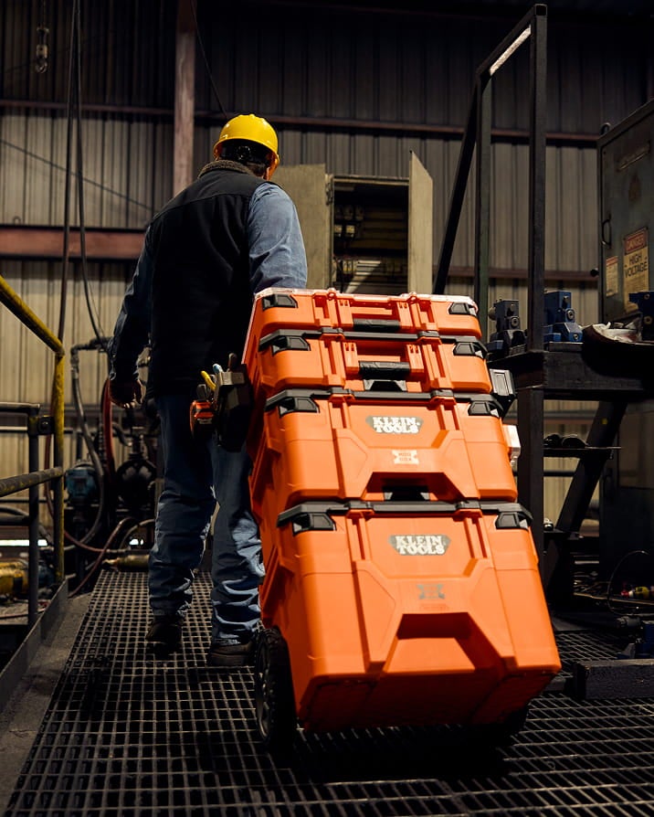 photo of man pulling a MODbox stack through an indoor worksite