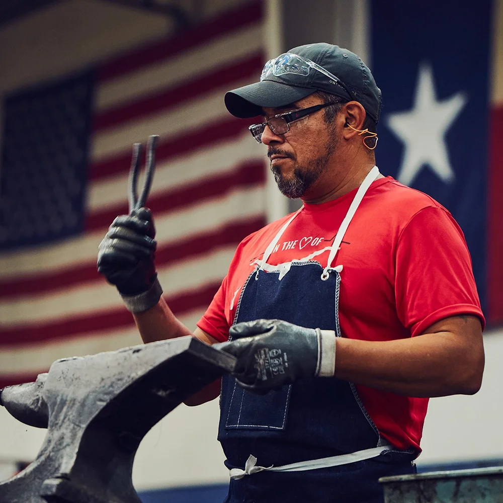 Klein Tools US forging plant worker building pliers with American flag in background