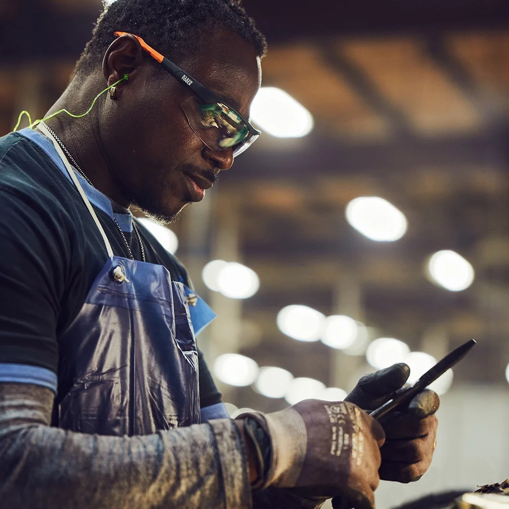 Klein Tools US forging plant worker inspecting new pair of pliers