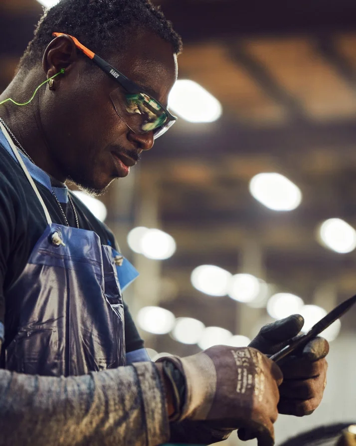 Klein Tools US forging plant worker inspecting new pair of pliers