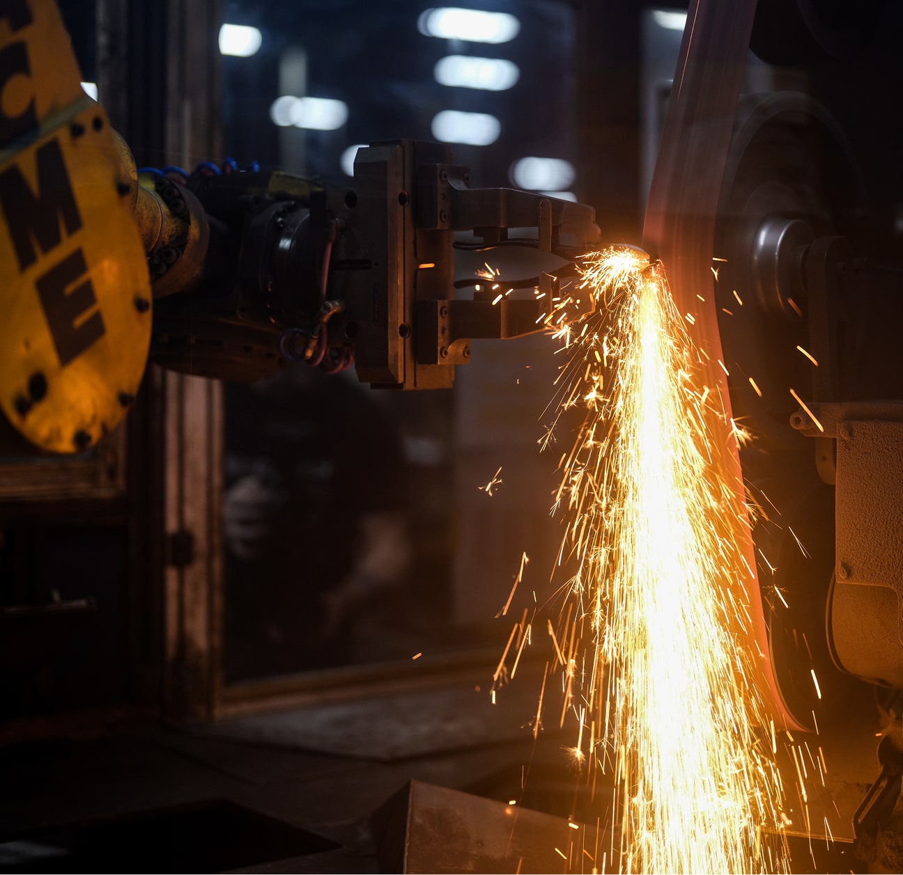 Klein Tools US forging plant worker grinding tools with sparks flying