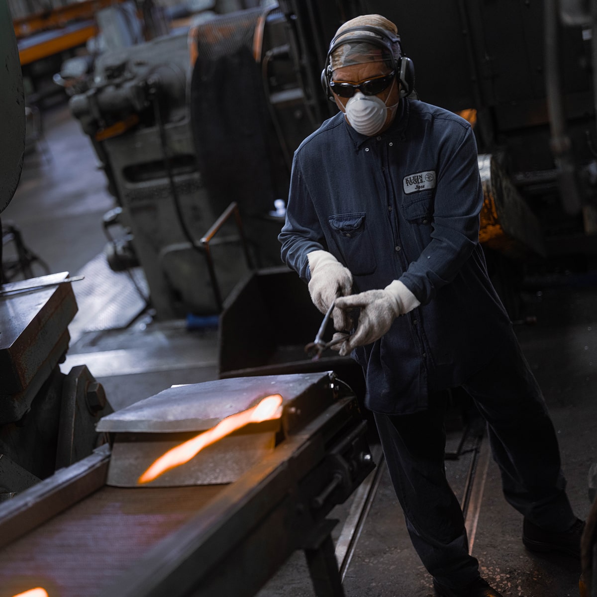 Klein Tools US forging plant worker handling forged steel
