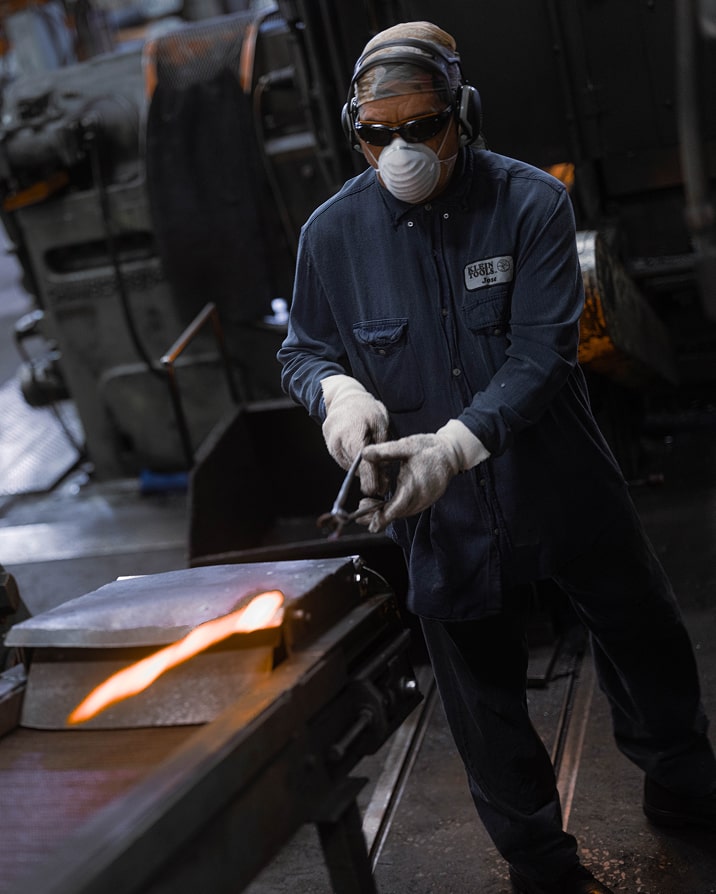 Klein Tools US forging plant worker handling forged steel